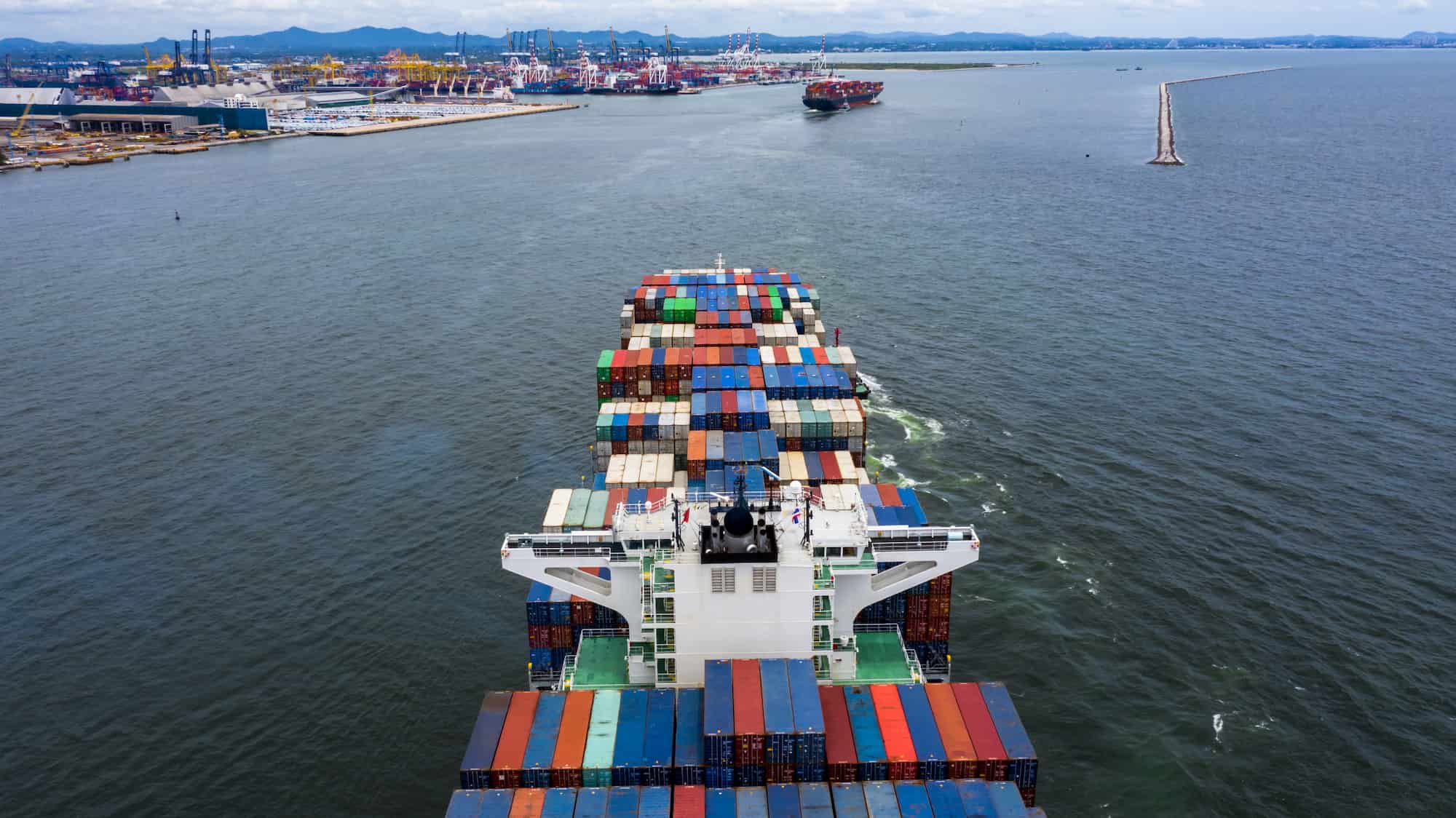 Cargo ship loaded with containers crossing open water