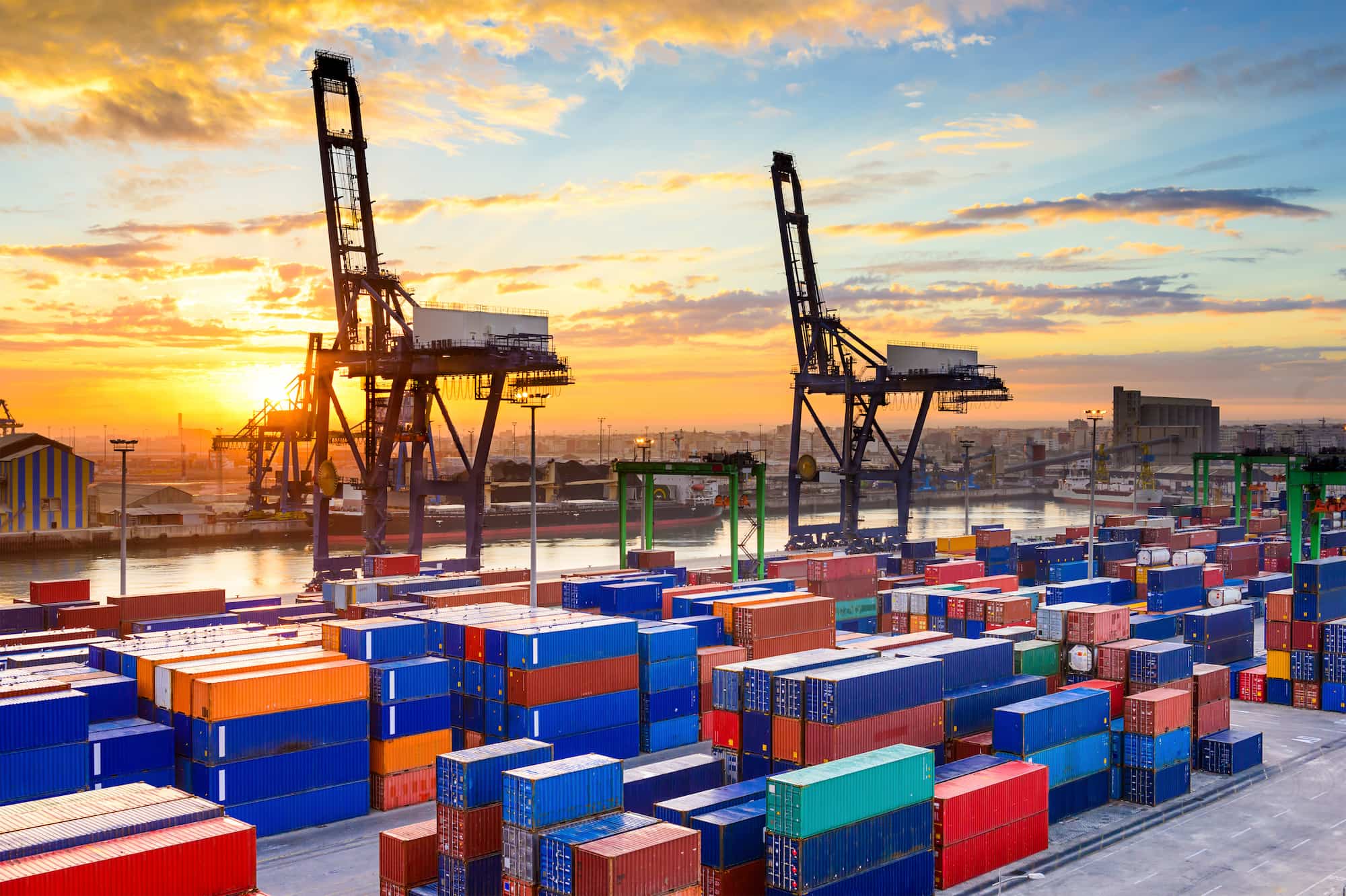 Aerial view of a busy logistics port with cargo containers